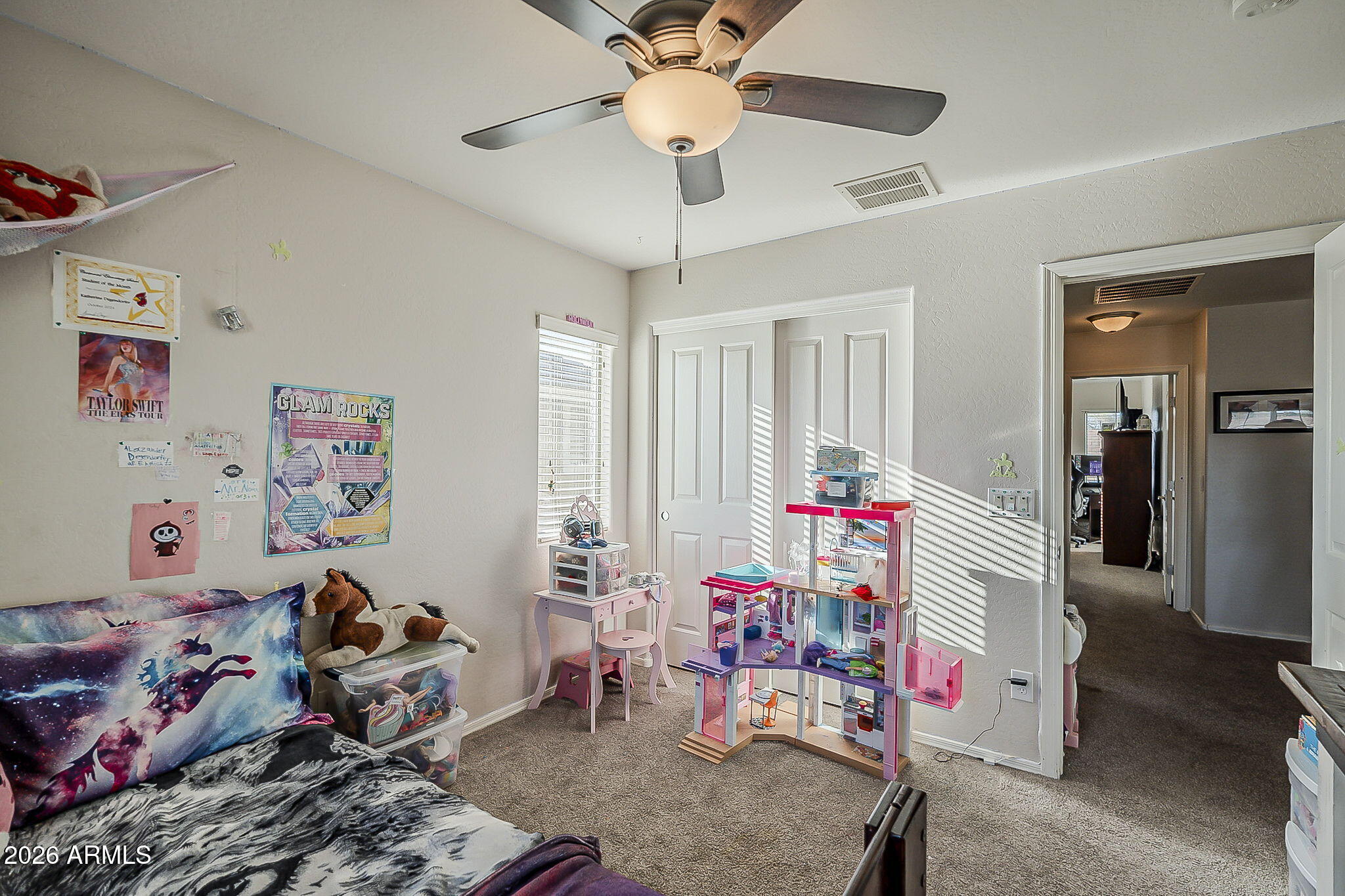 3816 East Phelps Street Gilbert, AZ 85295 - Photo 31 of 47 a living room with baby toys and a couch