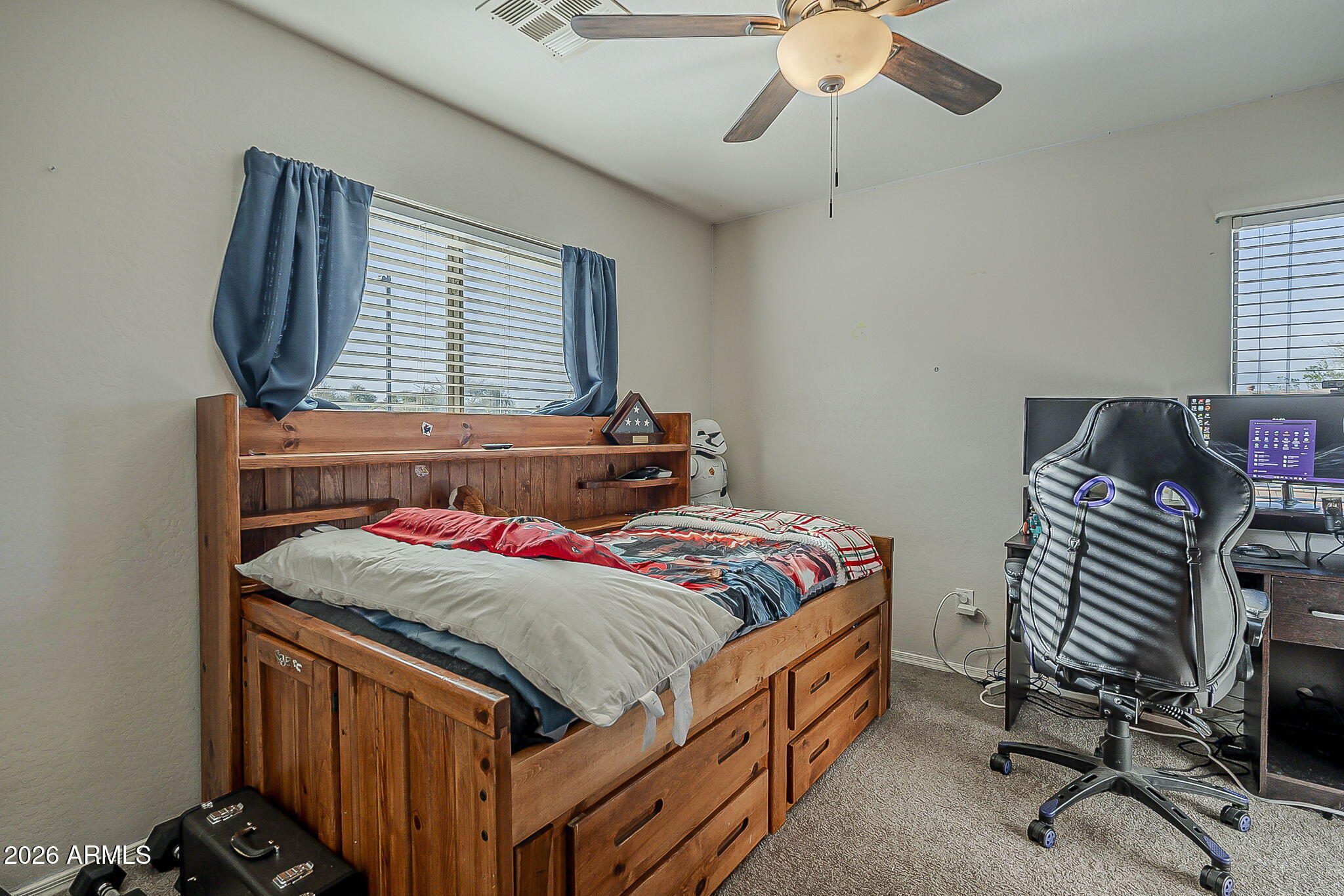 3816 East Phelps Street Gilbert, AZ 85295 - Photo 34 of 47 a bedroom with a bed and a chandelier