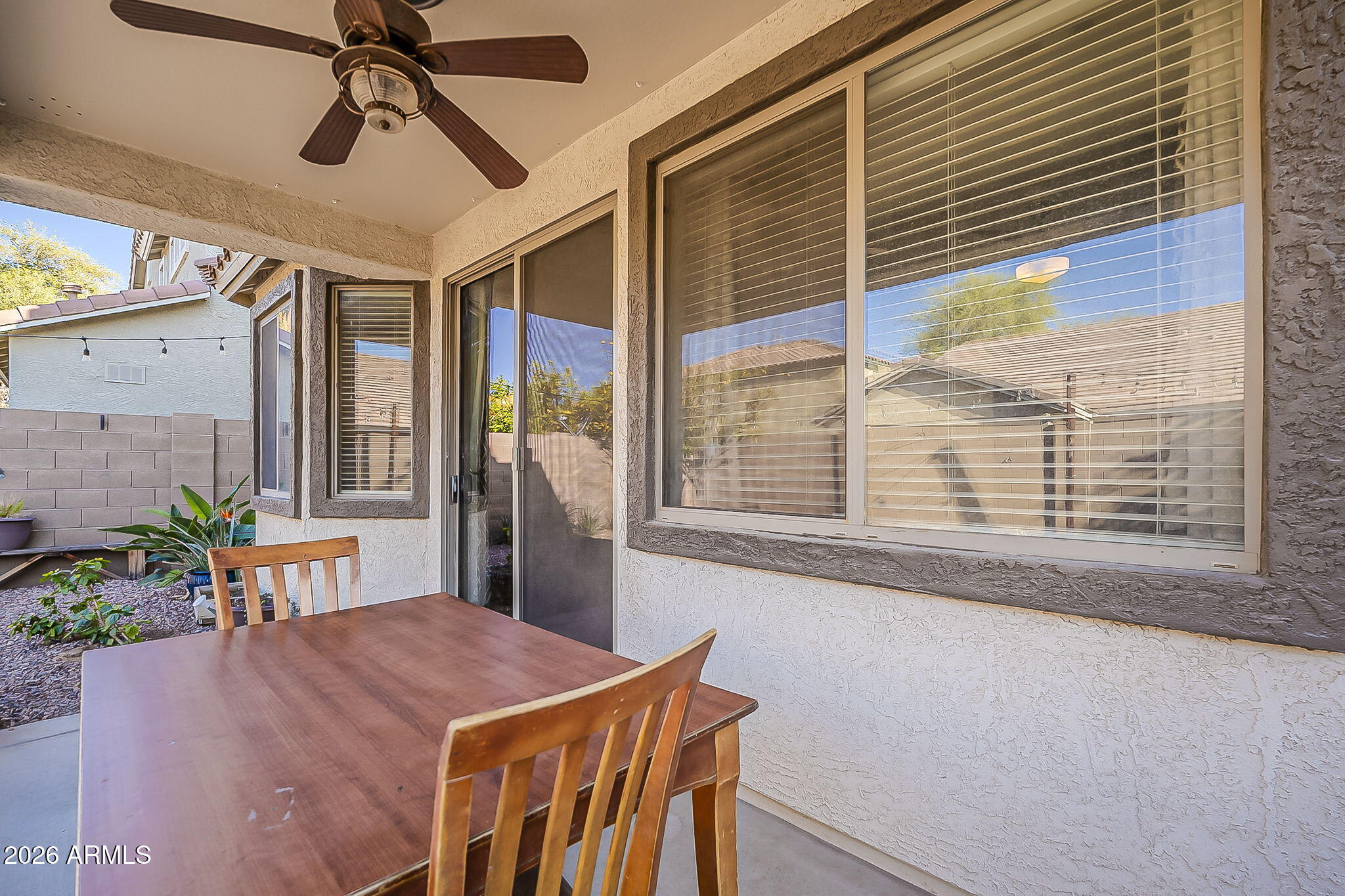 3816 East Phelps Street Gilbert, AZ 85295 - Photo 42 of 47 a dining room with a large window table and chairs