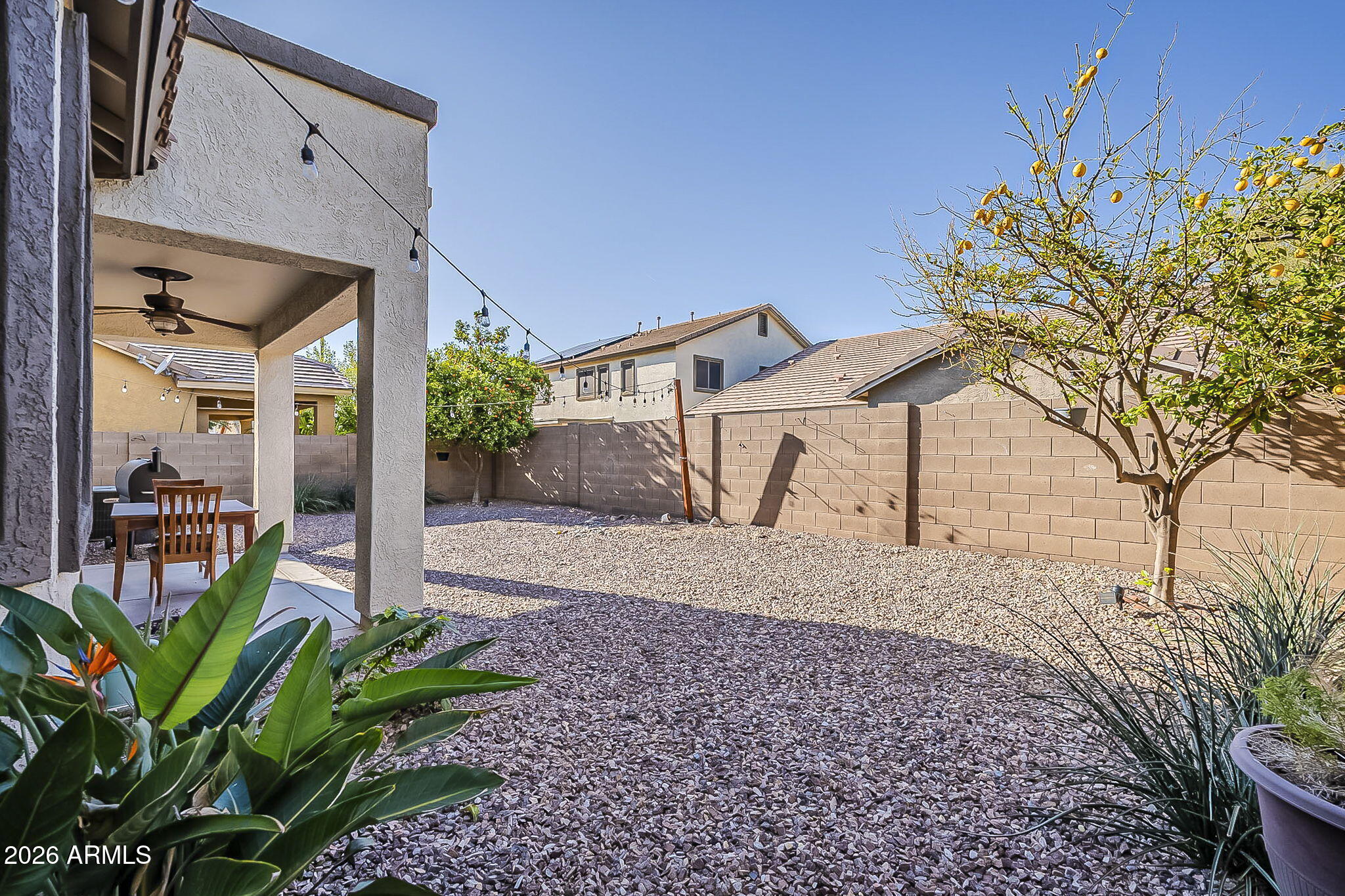 3816 East Phelps Street Gilbert, AZ 85295 - Photo 47 of 47 a view of a porch with a table and chairs under an umbrella