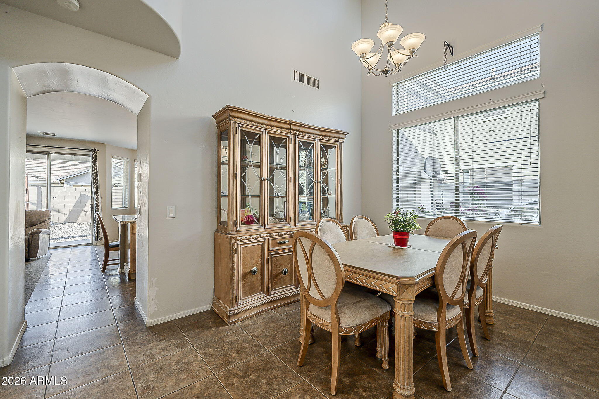 3816 East Phelps Street Gilbert, AZ 85295 - Photo 5 of 47 a view of a dining room with furniture and chandelier