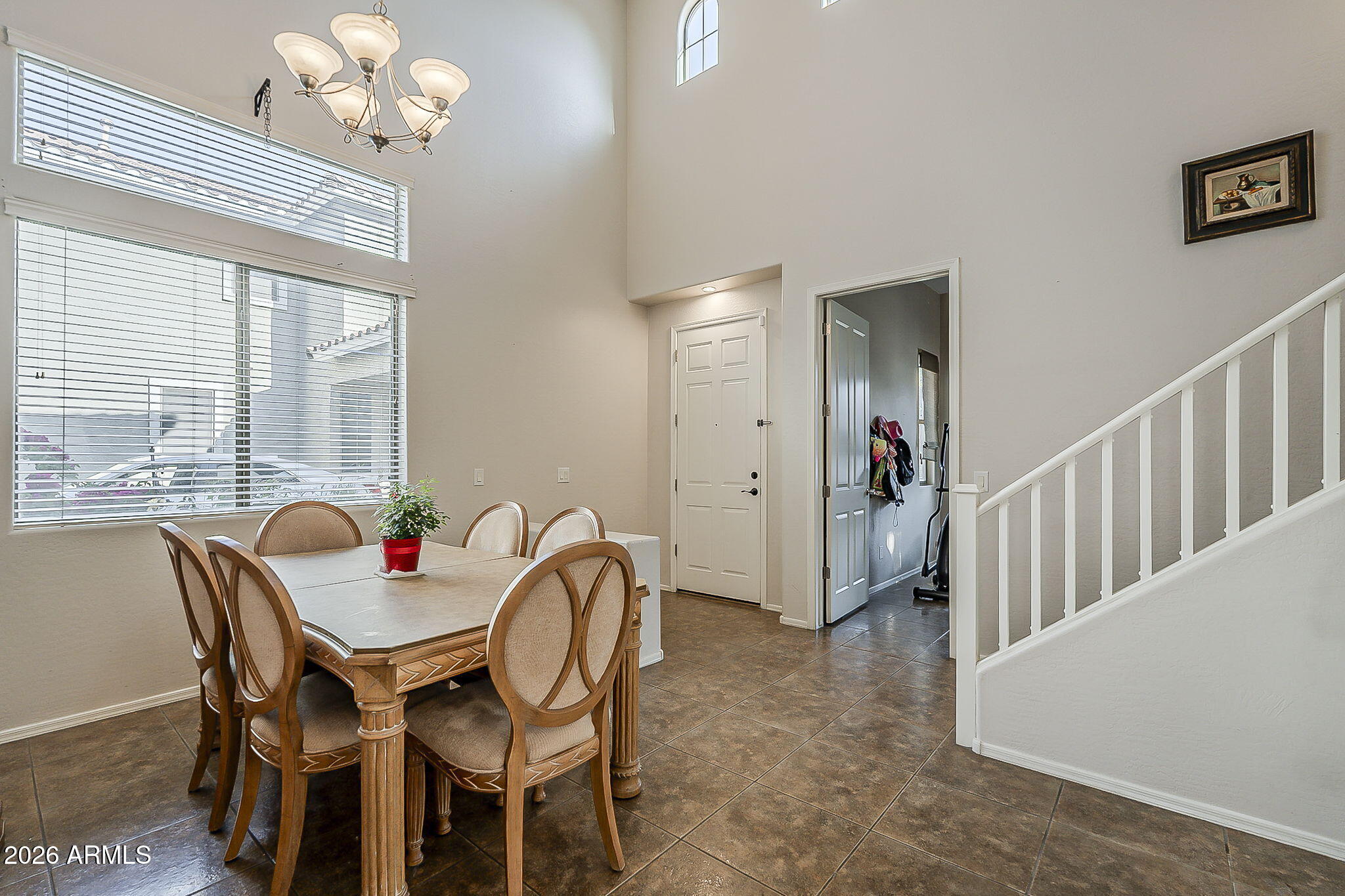 3816 East Phelps Street Gilbert, AZ 85295 - Photo 6 of 47 a view of a dining room with furniture and a chandelier