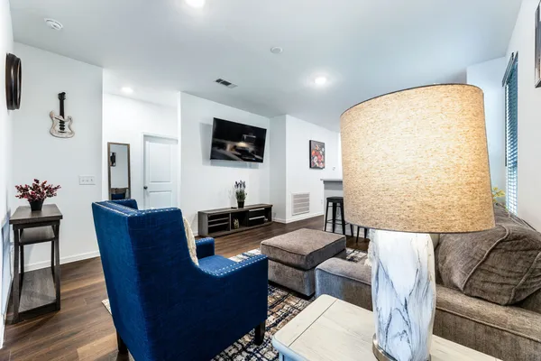 a living room with furniture and a flat screen tv