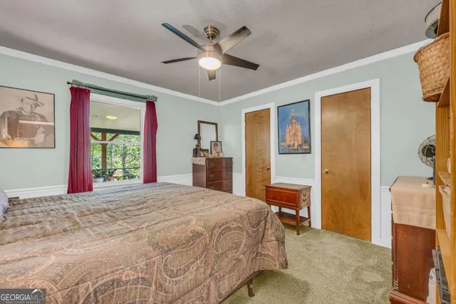 a view of a house with a yard large tree and a yard