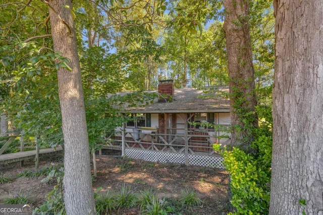 a view of a swimming pool with an outdoor space and seating area