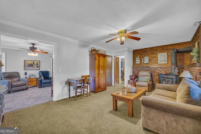 a kitchen with stainless steel appliances granite countertop a sink stove and microwave