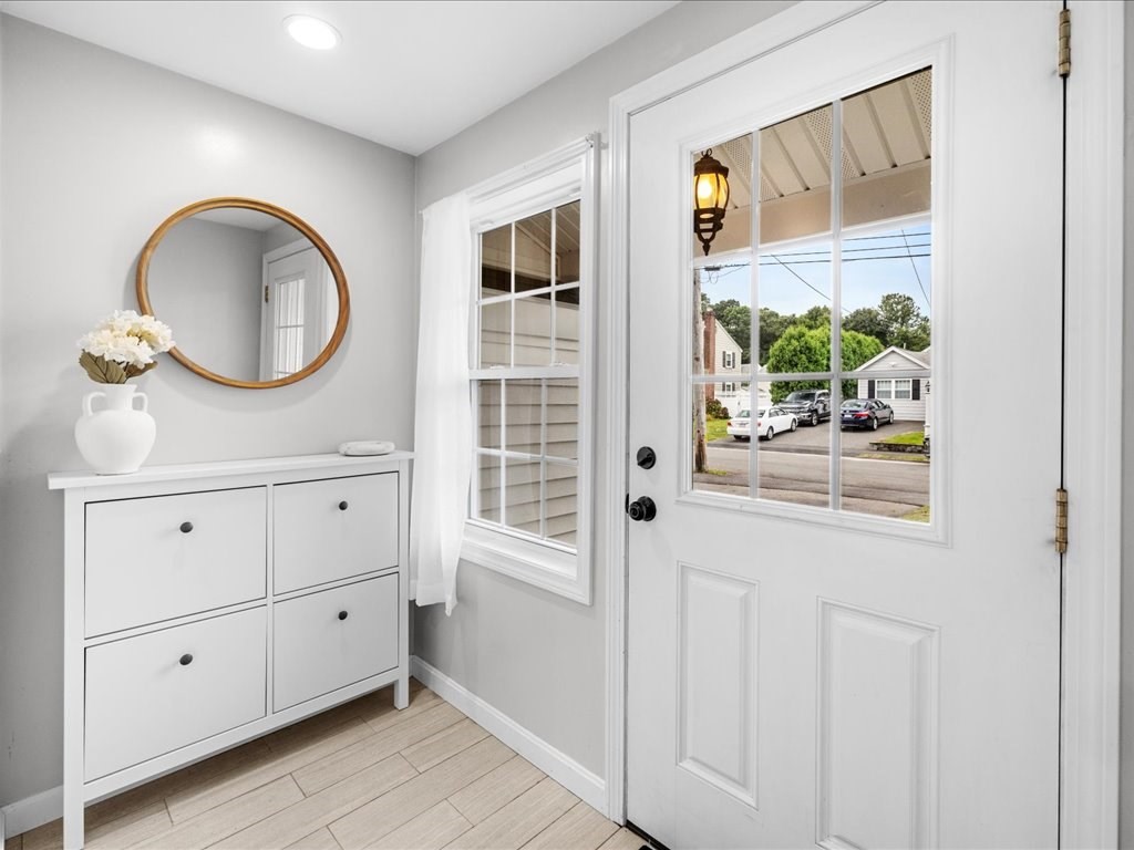 16 Lilly Lane Dedham, MA 02026 - Photo 11 of 27 a bathroom with a granite countertop sink a mirror and a shower