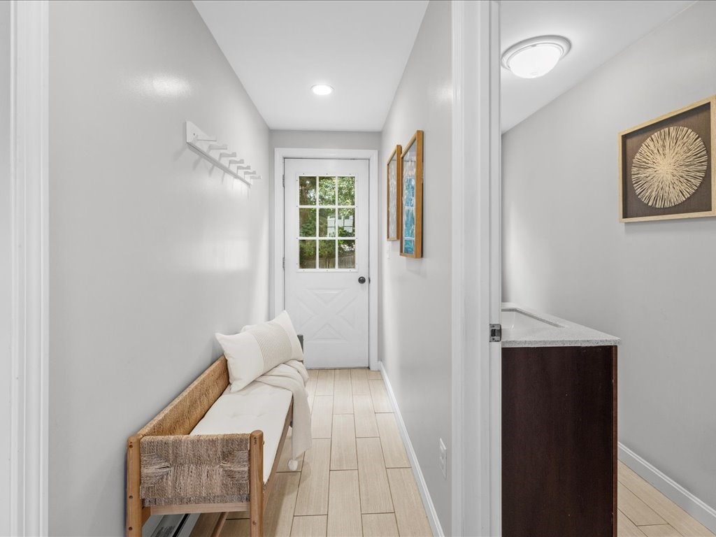 16 Lilly Lane Dedham, MA 02026 - Photo 12 of 27 a view of a bedroom with furniture and windows