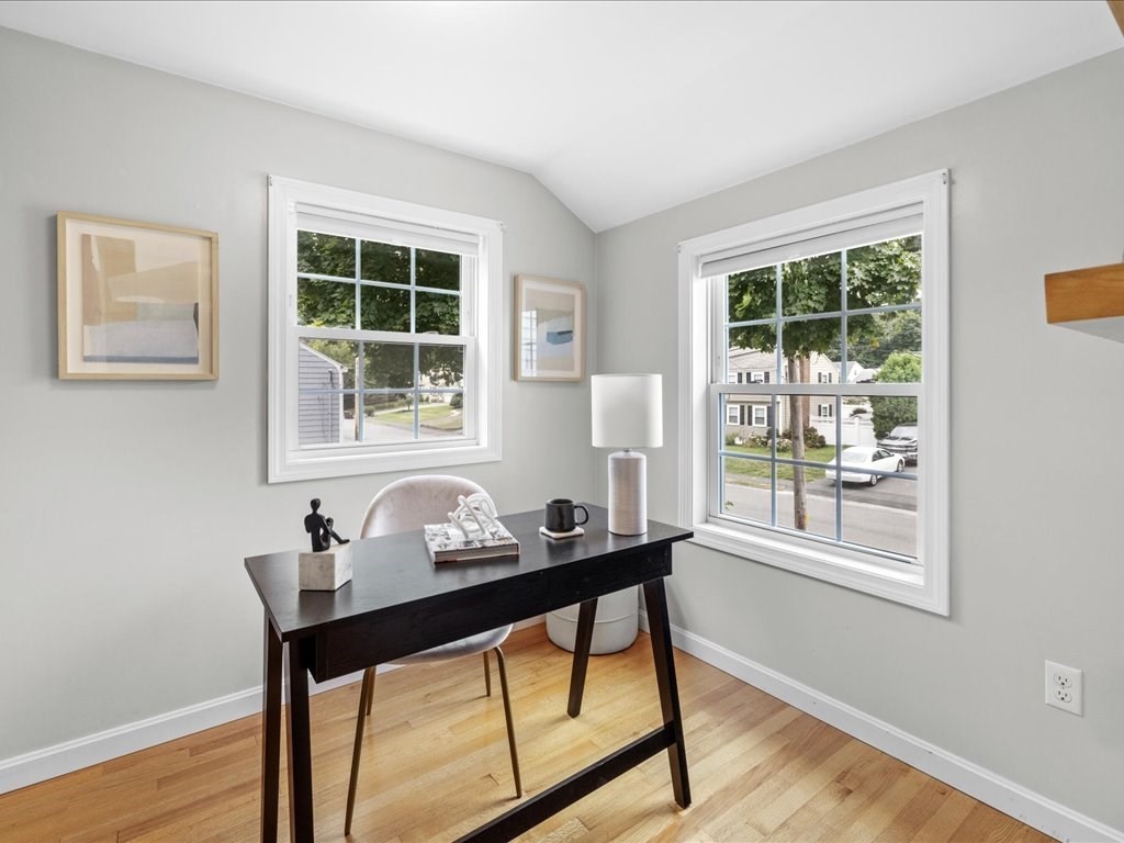 16 Lilly Lane Dedham, MA 02026 - Photo 14 of 27 a table and chairs in a room next to a window