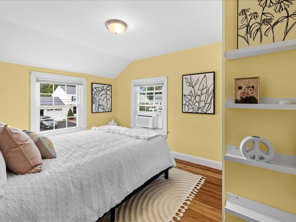 16 Lilly Lane Dedham, MA 02026 - Photo 19 of 27 a bedroom with a bed and a dresser