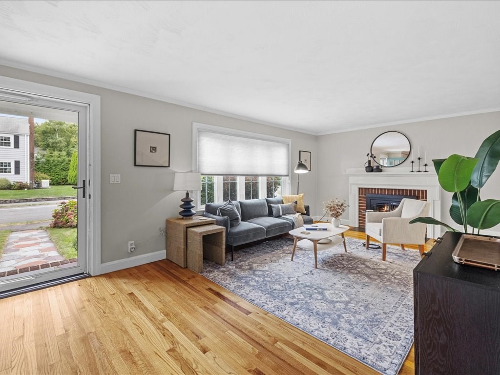 16 Lilly Lane Dedham, MA 02026 - Photo 2 of 27 a living room with furniture and a fireplace