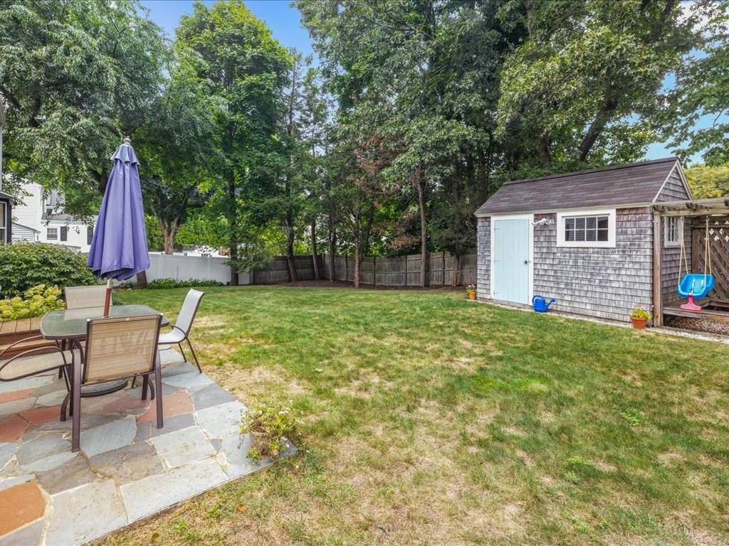 16 Lilly Lane Dedham, MA 02026 - Photo 22 of 27 a view of a backyard with a patio