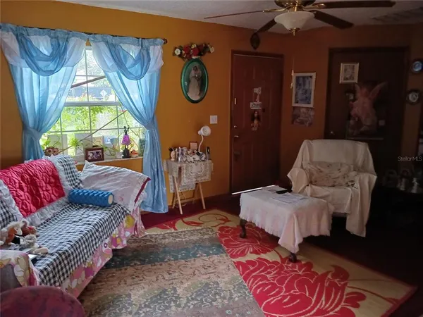 a living room with furniture and a window