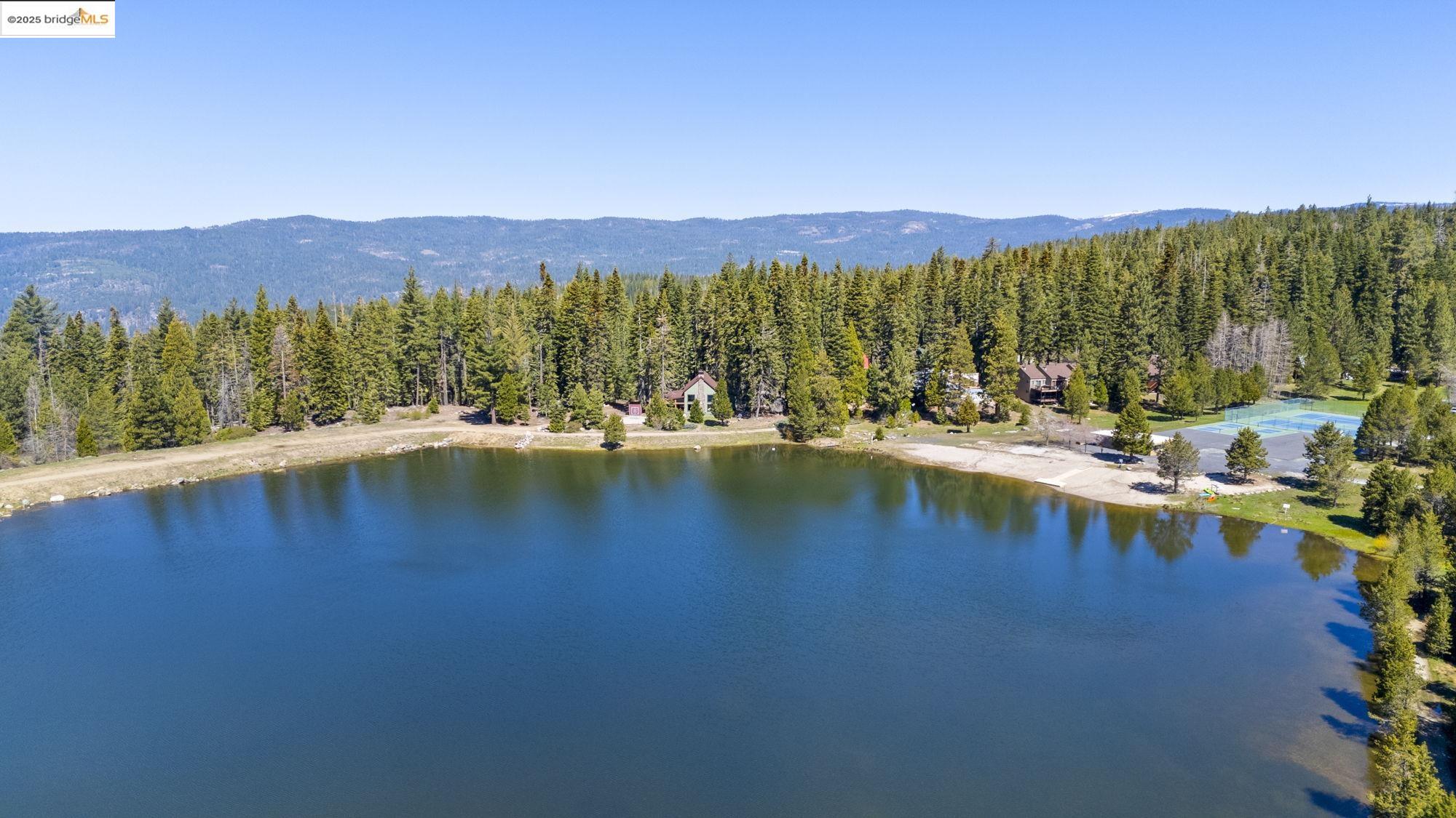 33994 Leland Meadow Road Pinecrest, CA 95364 - Photo 11 of 16 a view of an ocean with mountains in the background