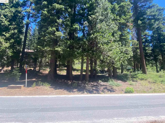 a view of an ocean with mountains in the background