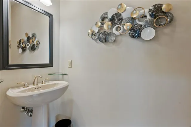 a bathroom with a sink and mirror