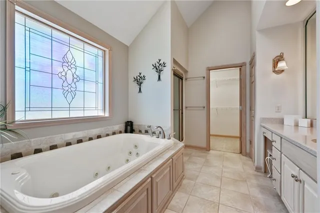 a bathroom with a bathtub and a shower