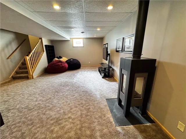 a view of a livingroom with furniture and a flat screen tv