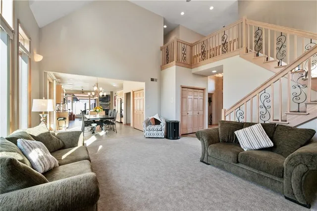 a living room with furniture ceiling fan and a rug