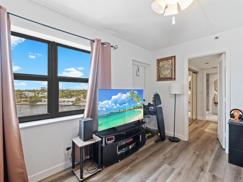 501 North Riverside Drive, Unit 601 Pompano Beach, FL 33062 - Photo 27 of 32 a room with furniture and flat screen tv
