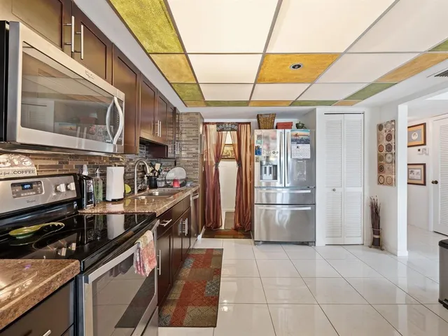 a view of a living room and entryway