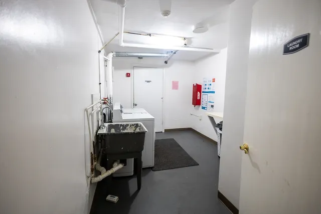 a view of a hallway with seating area