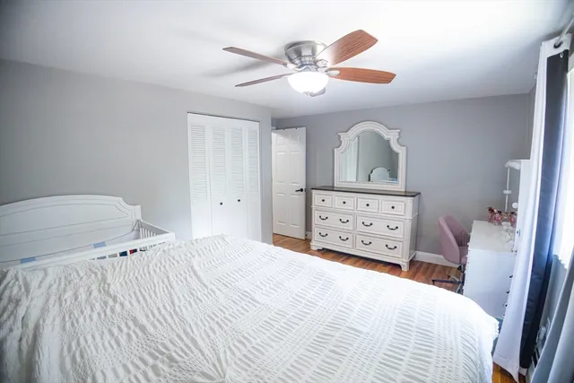 a bedroom with a bed and a cabinets