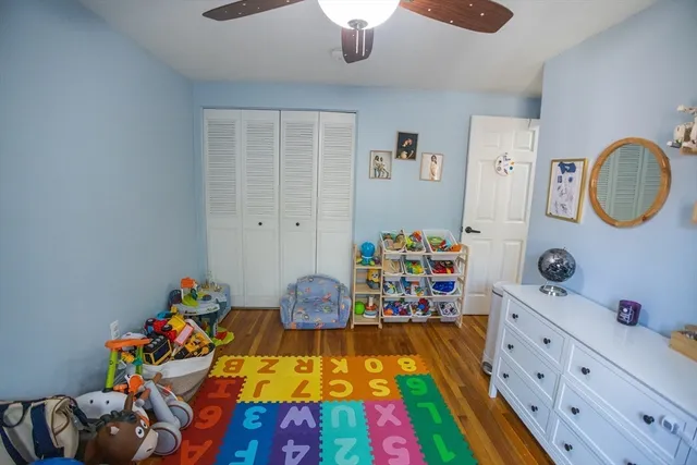 a very nice looking bedroom with a bed and a dresser