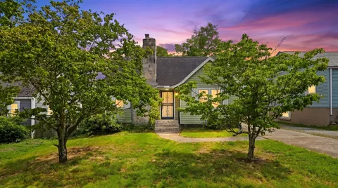 a view of a yard with a tree