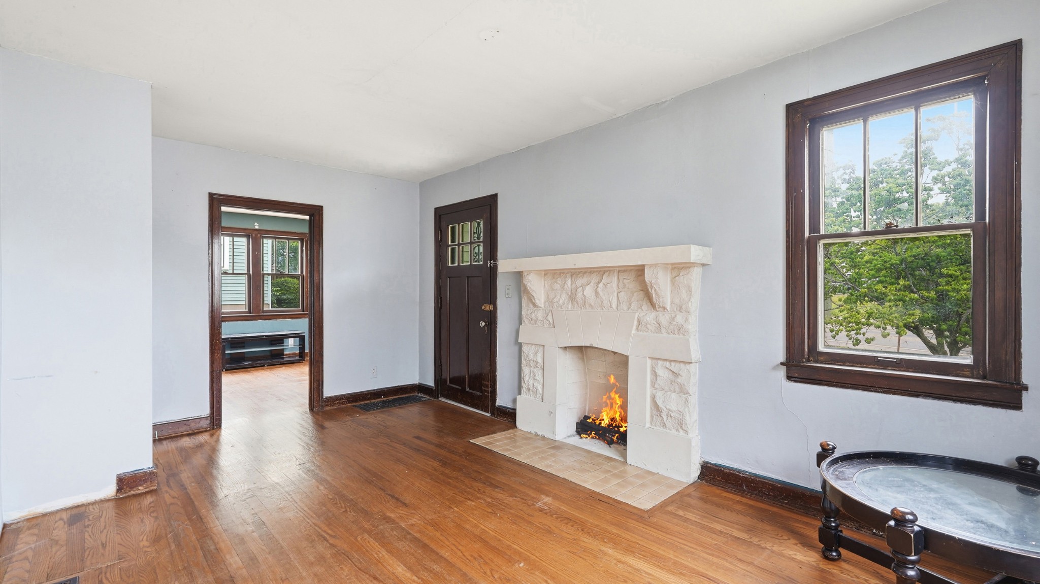 1603 Porter Road Nashville, TN 37206 - Photo 3 of 21 a view of an empty room with wooden floor and a window