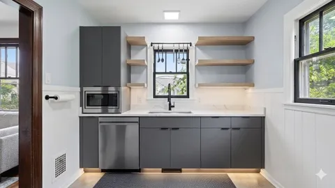 a kitchen with a sink cabinets and window