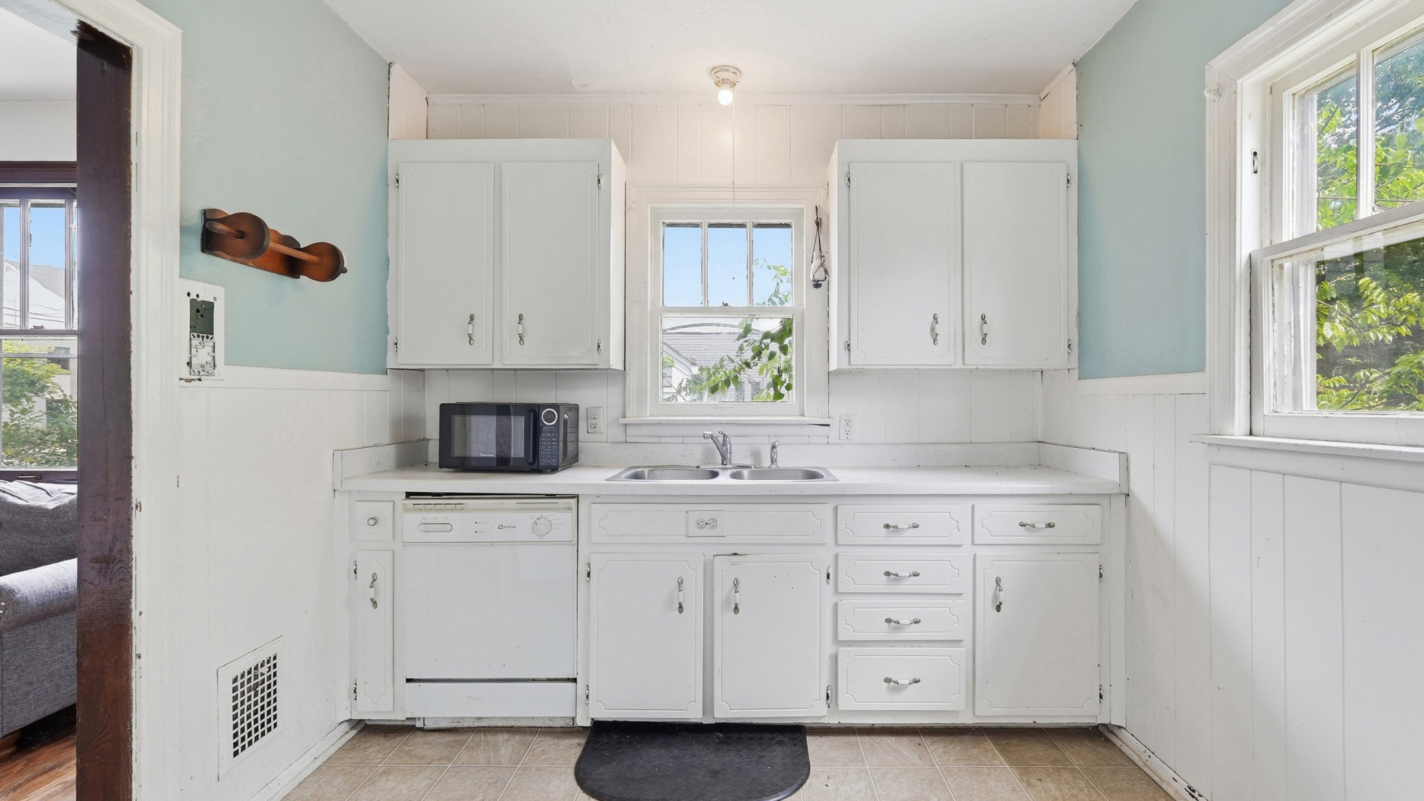 1603 Porter Road Nashville, TN 37206 - Photo 8 of 21 a kitchen with white cabinets and a window
