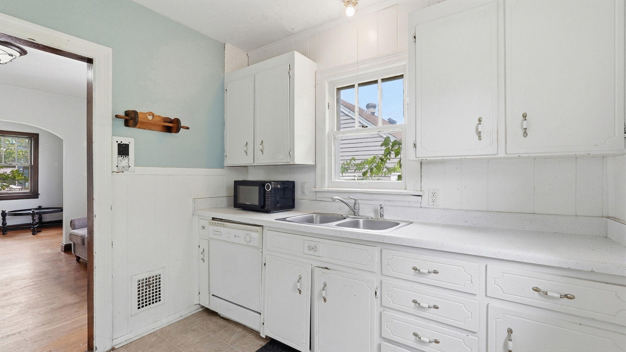 1603 Porter Road Nashville, TN 37206 - Photo 9 of 21 a kitchen with white cabinets and white appliances