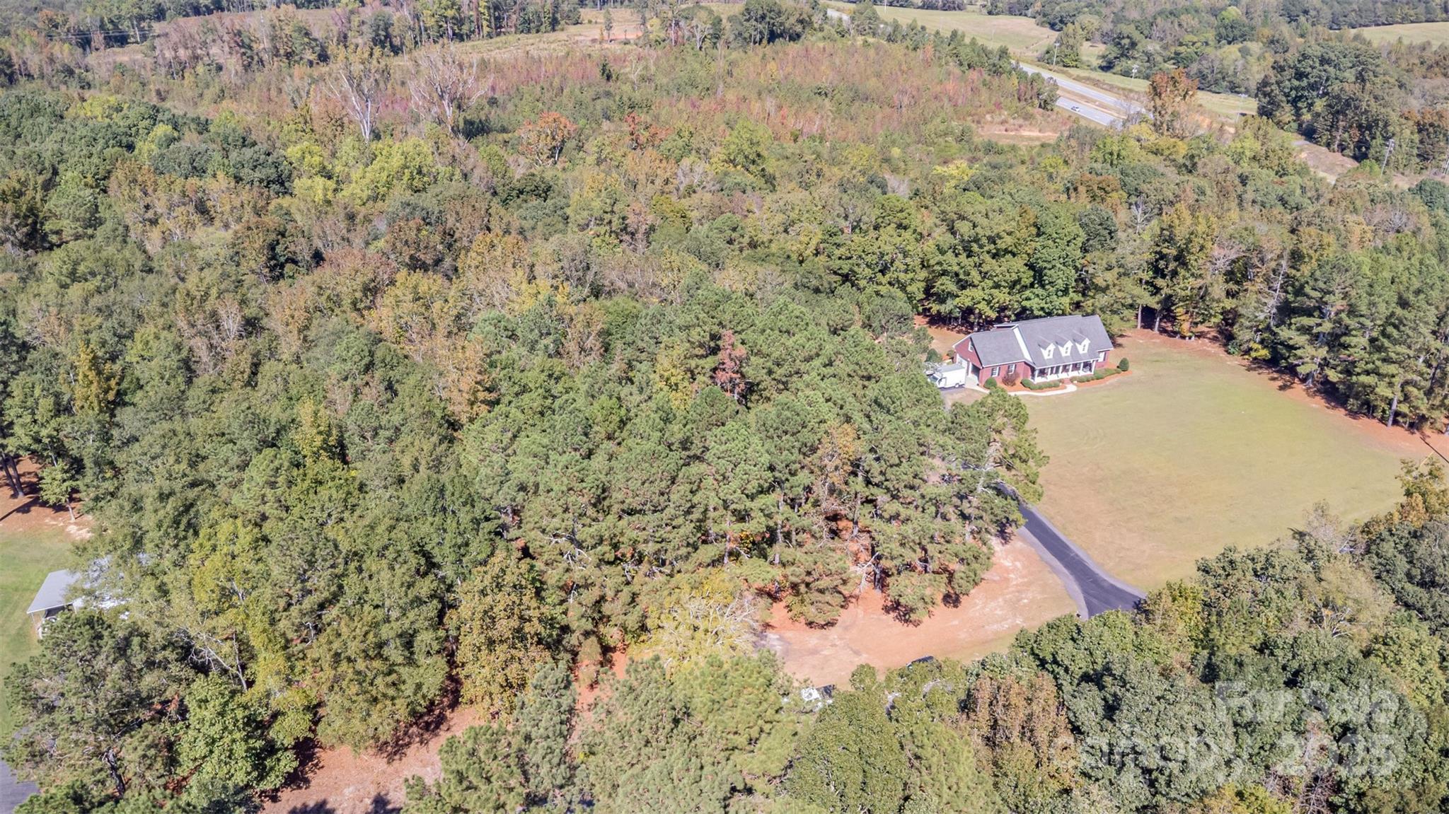 0 Will Evans Road, Unit LOT 2 B Jefferson, SC 29718 - Photo 14 of 15 a view of a area with wooden wall and bench