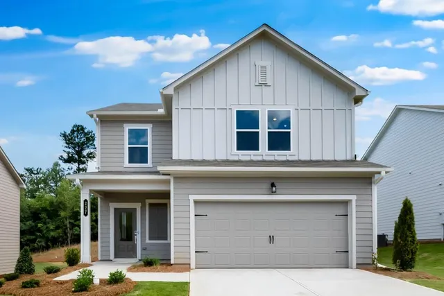 a front view of a house with garage