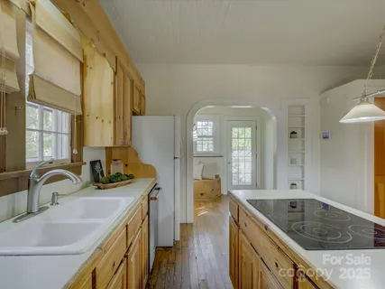 a bathroom with a granite countertop double vanity sink and mirror with bathtub