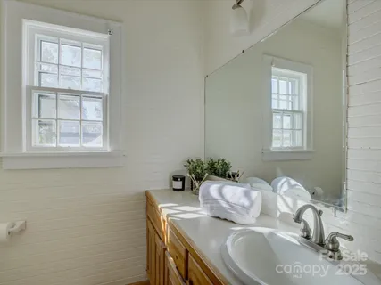 a bedroom with a bed and ceiling fan