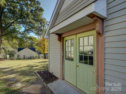 a view of house with yard