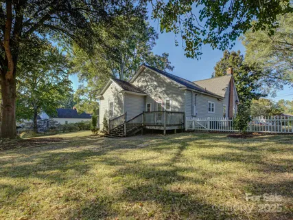 a view of a house with a small wooden stairs