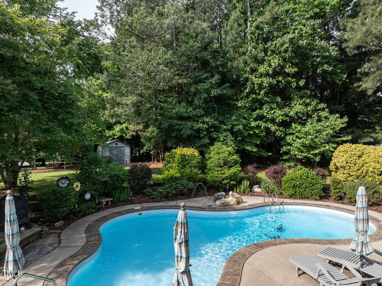 1201 Kalworth Road Wake Forest, NC 27587 - Photo 16 of 76 a view of a swimming pool with a yard