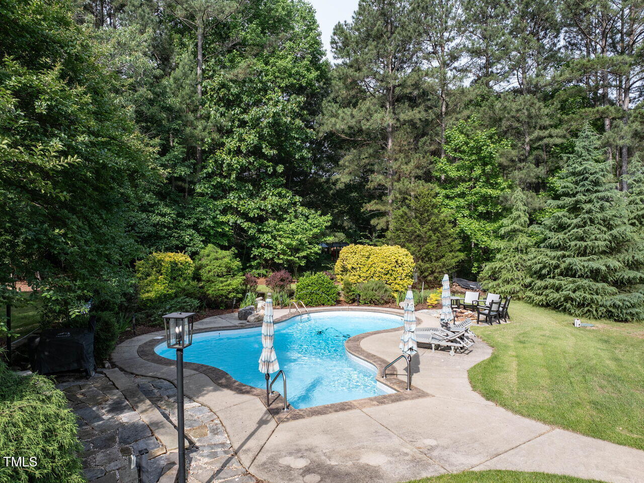 1201 Kalworth Road Wake Forest, NC 27587 - Photo 17 of 76 a view of a swimming pool with a patio