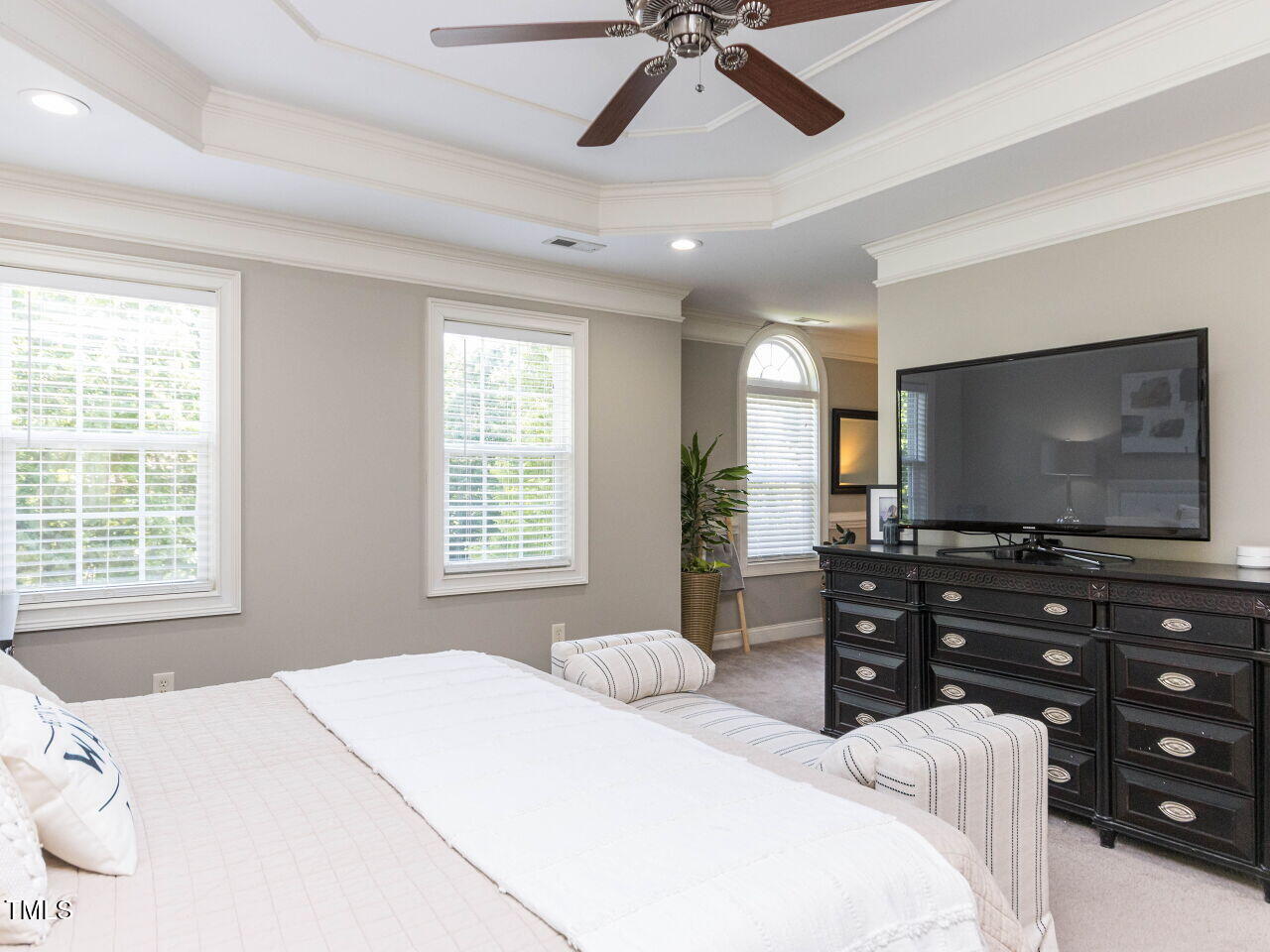 1201 Kalworth Road Wake Forest, NC 27587 - Photo 26 of 76 a bedroom with a bed and a flat screen tv