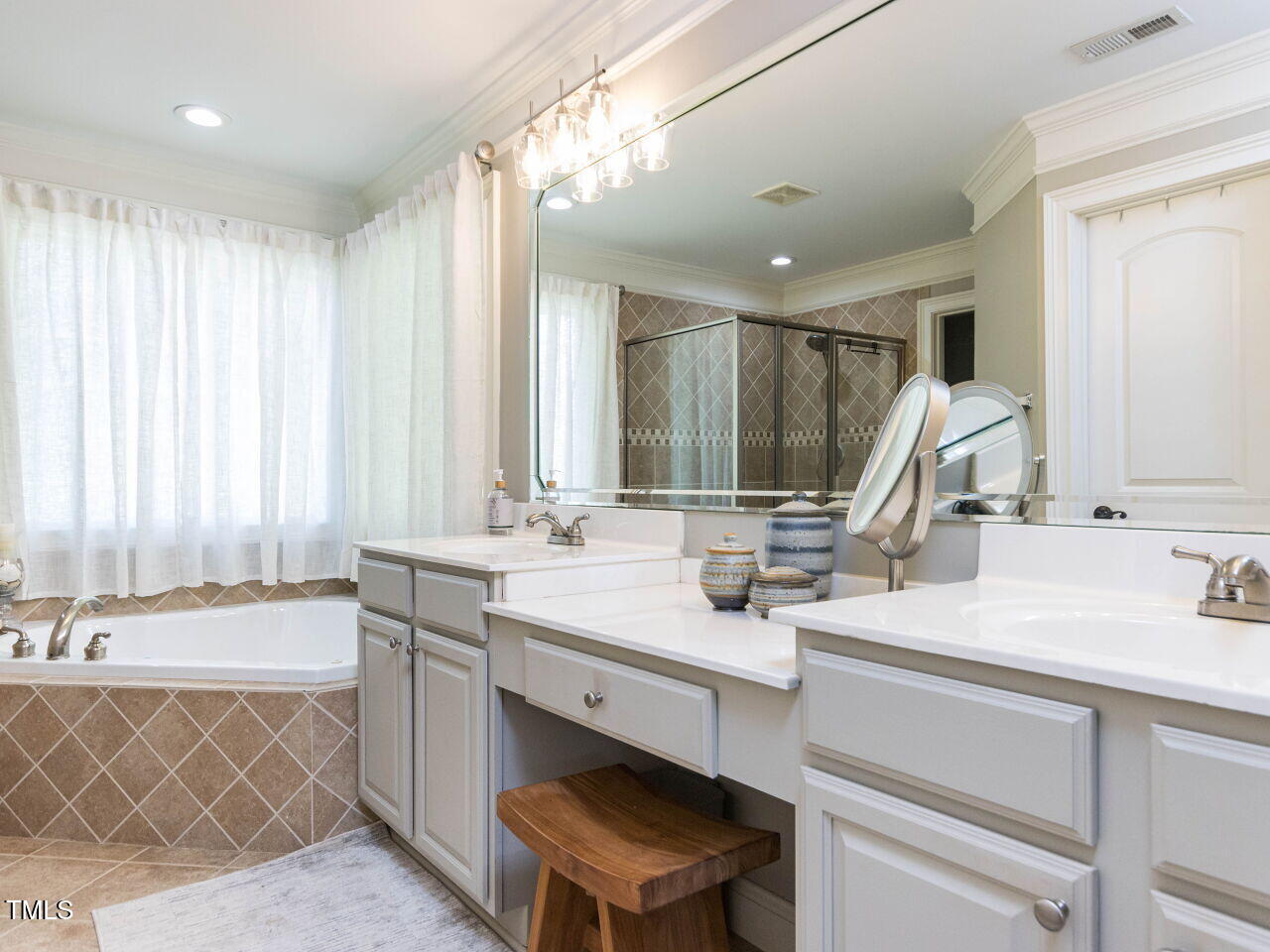 1201 Kalworth Road Wake Forest, NC 27587 - Photo 28 of 76 a bathroom with a double vanity sink mirror and a bathtub