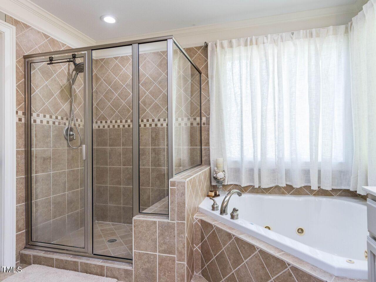 1201 Kalworth Road Wake Forest, NC 27587 - Photo 29 of 76 a bathroom with a tub and shower
