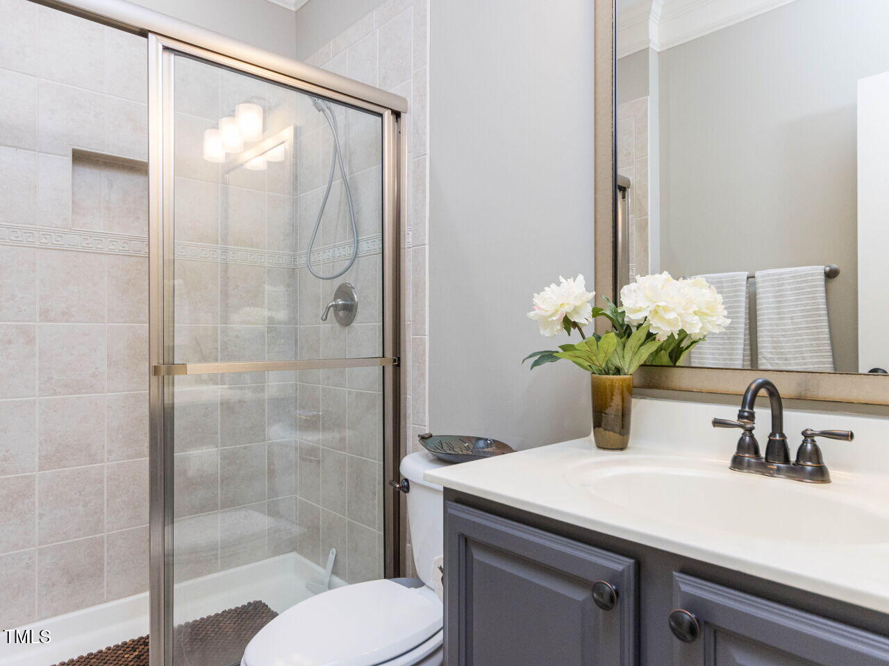 1201 Kalworth Road Wake Forest, NC 27587 - Photo 34 of 76 a bathroom with a sink a toilet and shower