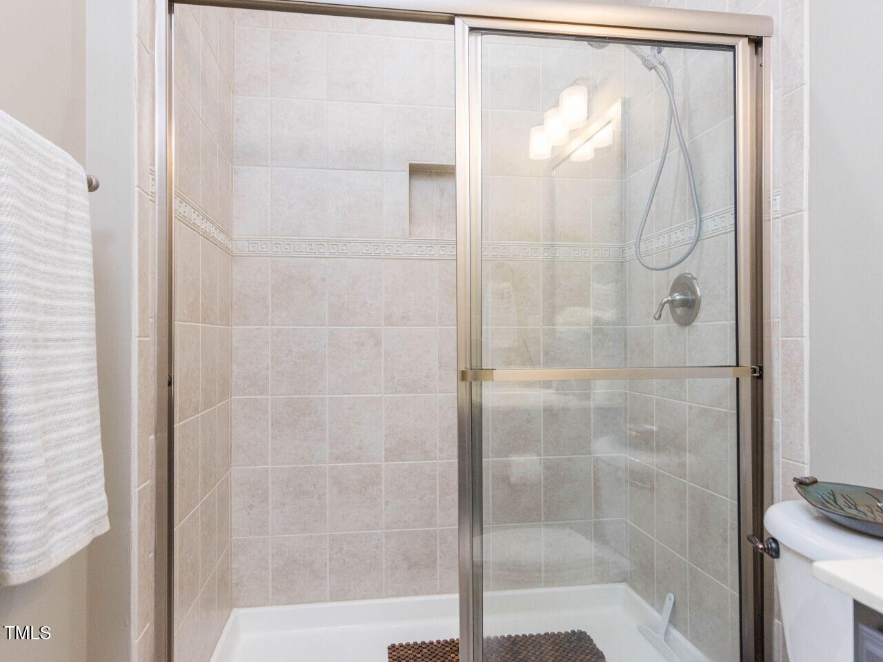 1201 Kalworth Road Wake Forest, NC 27587 - Photo 35 of 76 a bathroom with a glass shower door