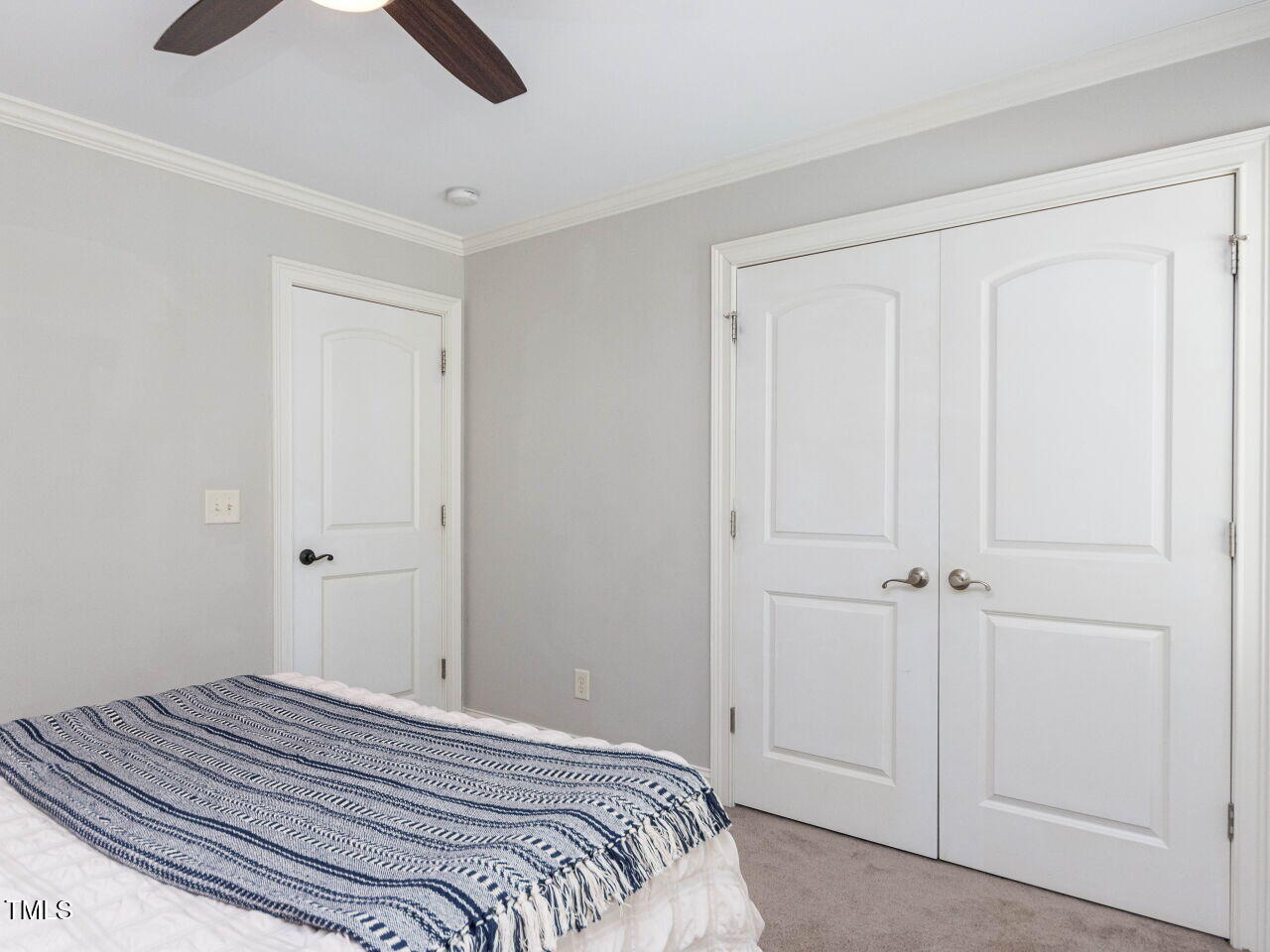 1201 Kalworth Road Wake Forest, NC 27587 - Photo 41 of 76 a bedroom with a bed and a chandelier fan