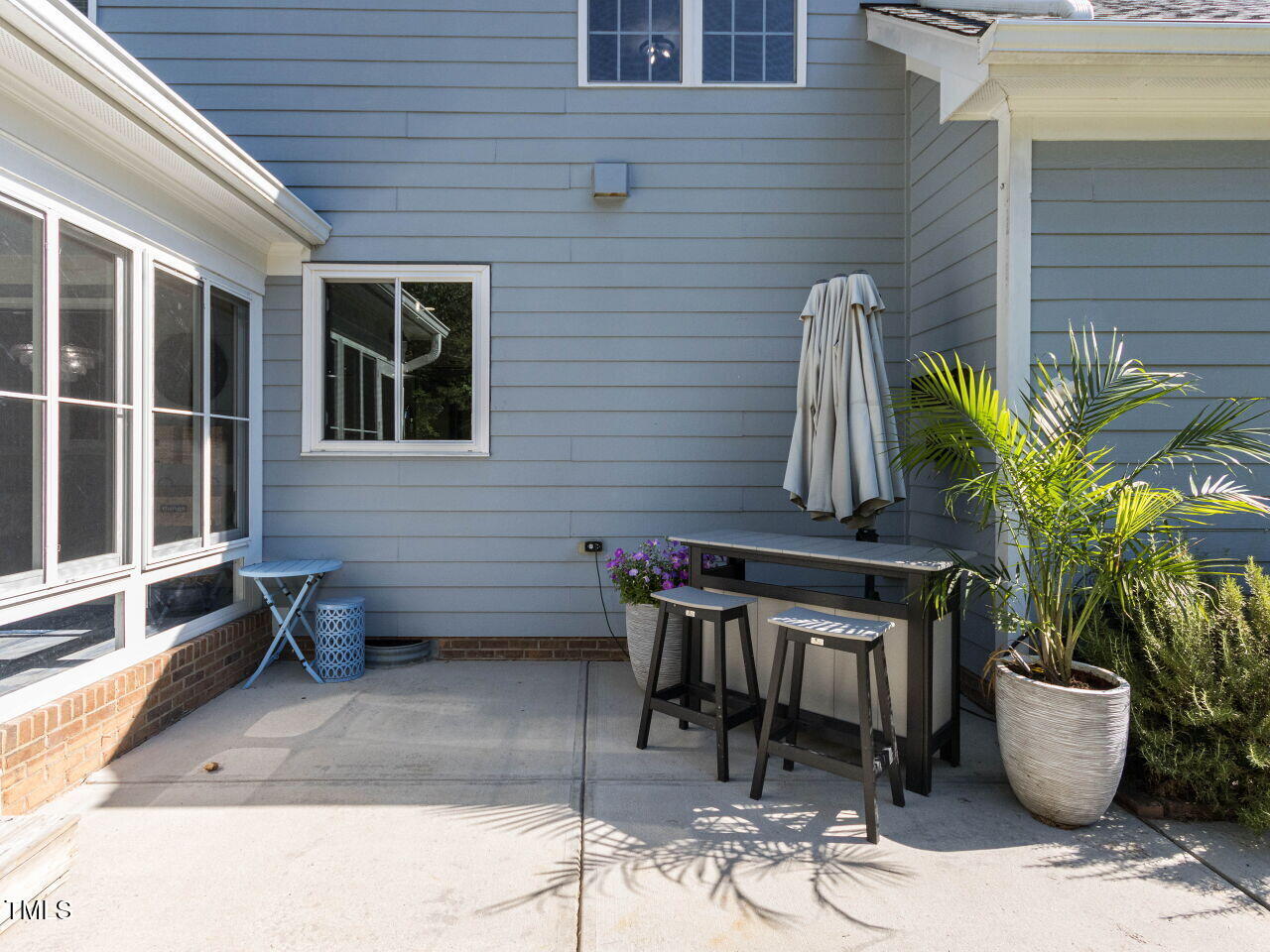 1201 Kalworth Road Wake Forest, NC 27587 - Photo 49 of 76 a view of a patio with table and chairs and potted plants
