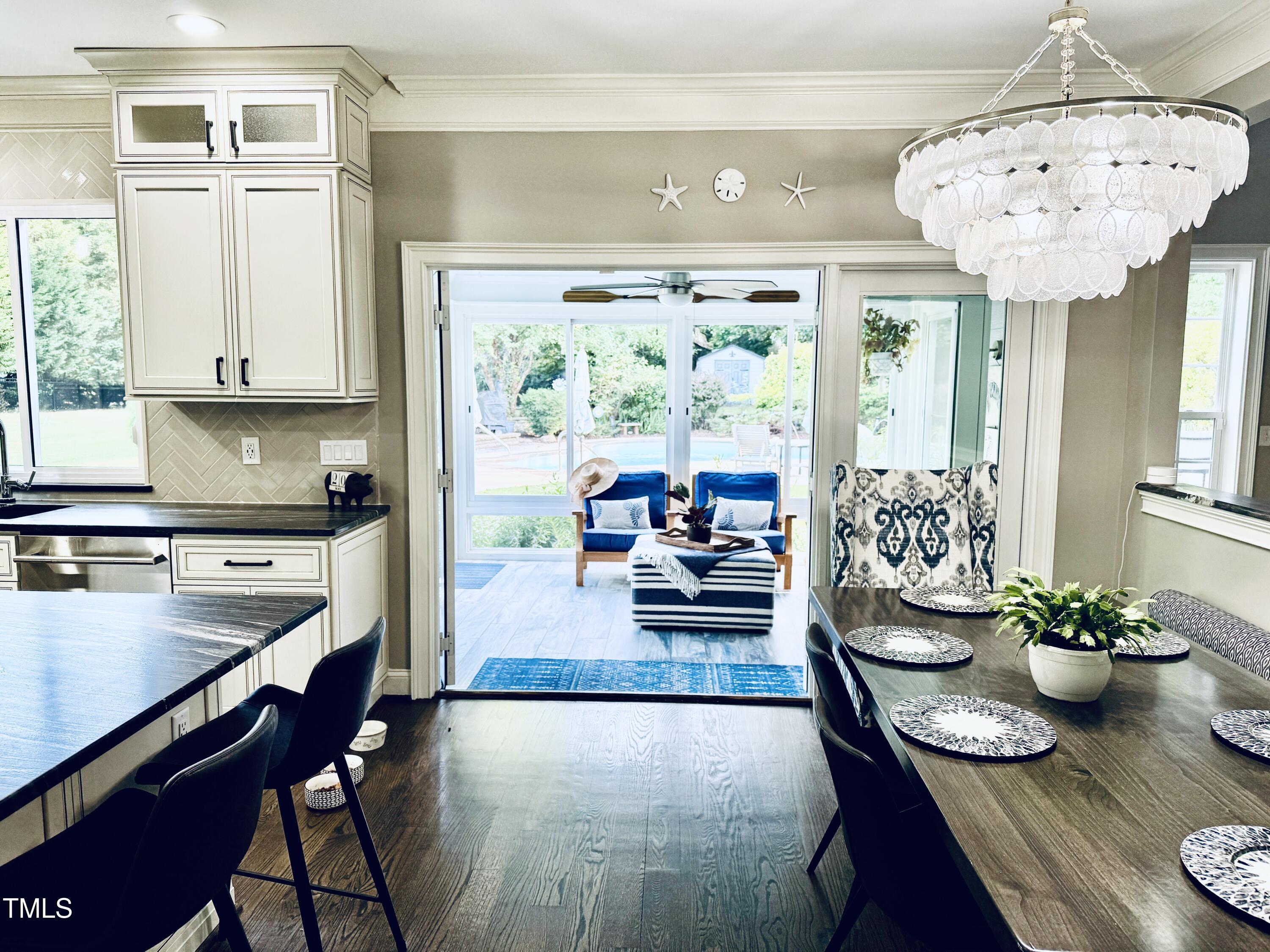 1201 Kalworth Road Wake Forest, NC 27587 - Photo 5 of 76 a kitchen with a table chairs stove and cabinets