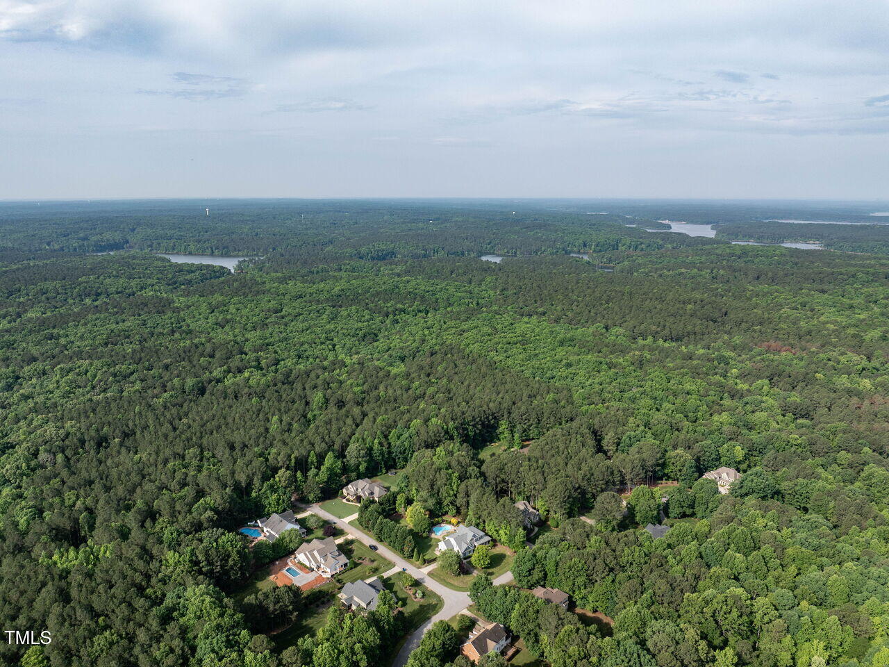 1201 Kalworth Road Wake Forest, NC 27587 - Photo 60 of 76 an aerial view of residential houses with outdoor space and trees